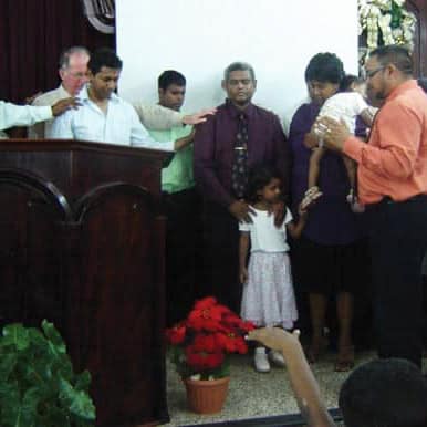 Prayer at service in Trinidad