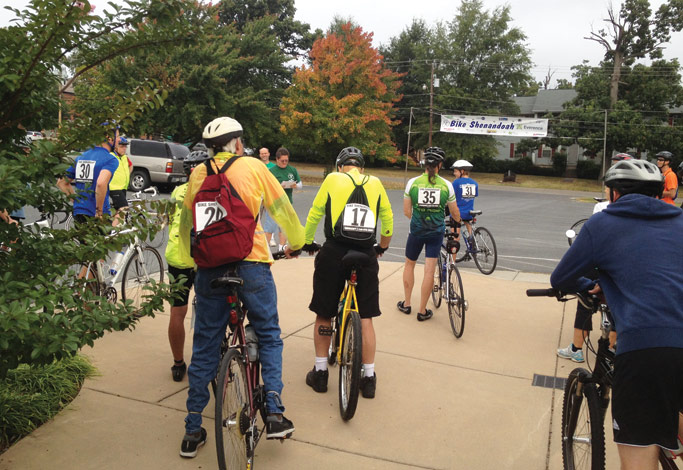 Riders receive instructions just prior to their ride on September 21. Riders could choose between five route lengths, from a five-mile family ride to a 100-mile ride. Photo by Lori Doll