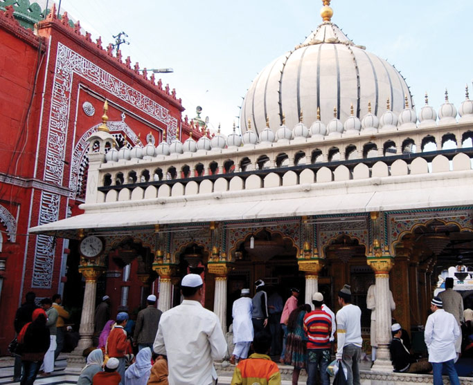 Muslim pilgrims gather at a shrine holy to Islam. Courtesy of authors