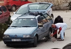 Vince helps fix Abram’s tire. Courtesy photo