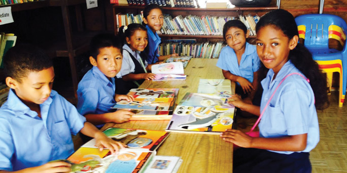 Students read and study in the library where Nancy works.