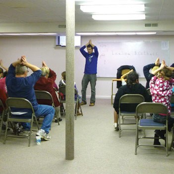 Seth Crissman leads an activity at Kids Club