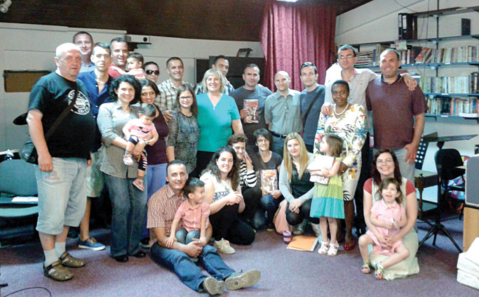 The church in Podgorica that Steve and Laura relate to. A number of people pictured have been engaged in discipleship training, including Lazar (seated, holding his son Jacob) and his wife Masha (standing above Lazar, with glasses). Photo courtesy of Steve Campbell 