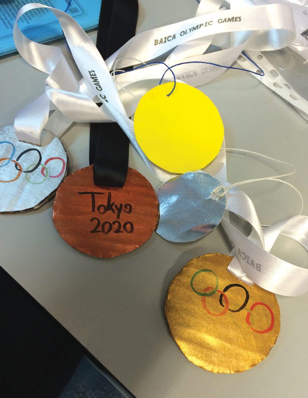 Creative students designed  medals for mock Olympic games.