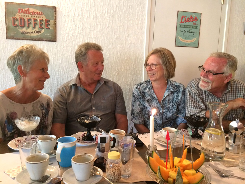 Esther and Don Clymer (right) share coffee time with Swiss friends Walter and Regina. Photo courtesy of author