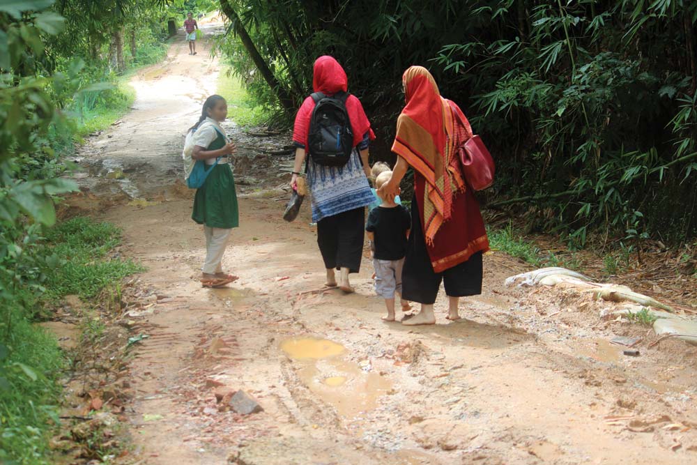 A muddy dirt track leads to a Rohingya family’s home. They are a stateless people in Myanmar who have been persecuted, with many escaping into refugee camps in a neighboring country. Photo courtesy of Hosanna