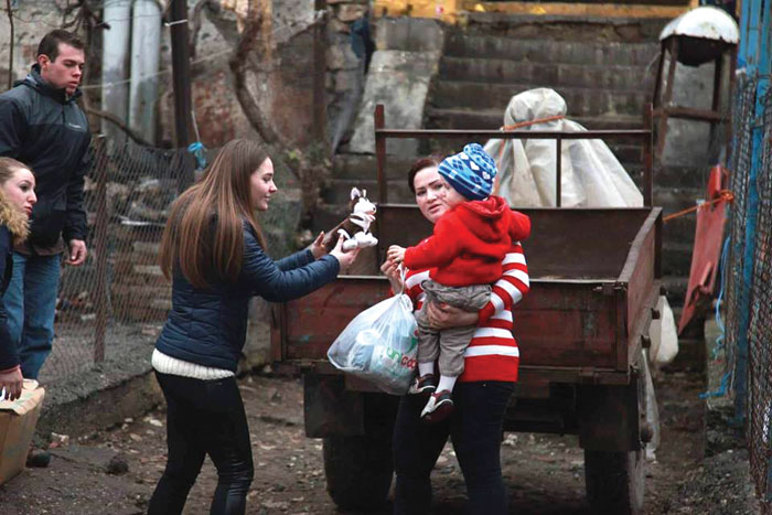 LAC students distribute supplies to families in Lezhë as part of a service project.