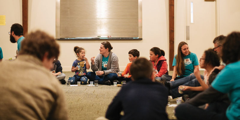 Snack time is a wonderful opportunity for Kids Club  volunteers to interact with the kids and show God’s love. Photo courtesy of Seth Crissman