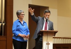 Aaron Kauffman, President, and Lavonne Lehman, Board Chair, share a welcome at the centennial program