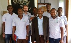 Employees of World Harvest Mission after a Bible study: (from left) Happy Michael, Mugisa, Brent Justice, Kapu, Kisembo Akleo, Kadema, Ahebwa Johnson, and Tibesigwa. Photo courtesy of Brent Justice