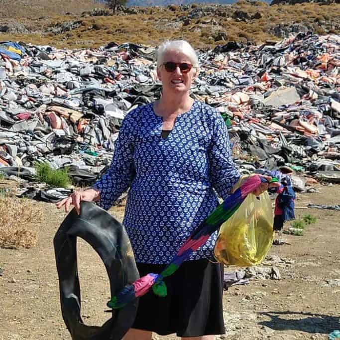 Casey with items found in the trash pile