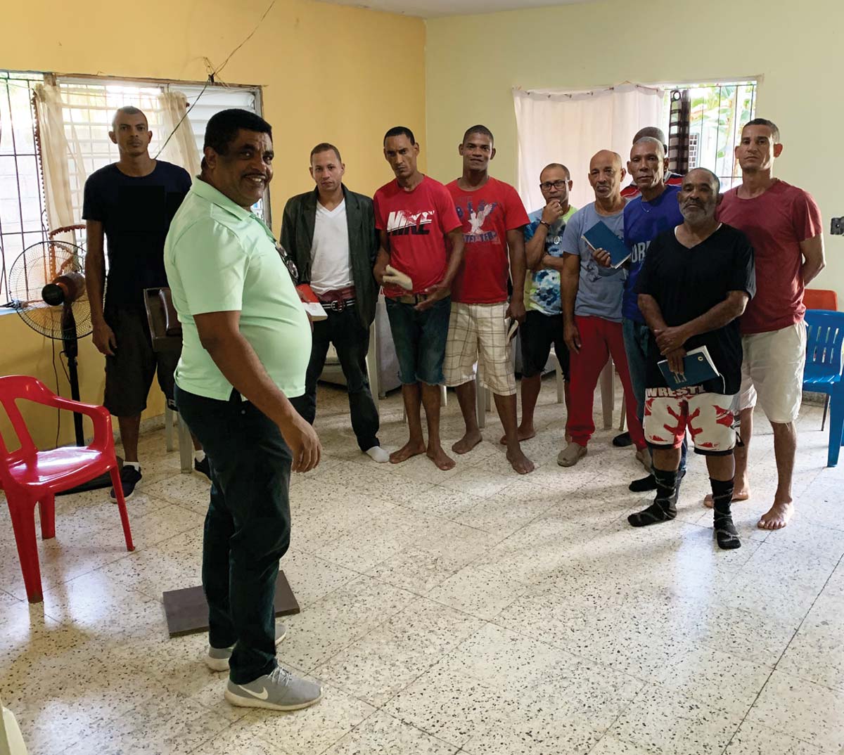 Diomedes Franco (foreground) meets with men in the community of La Vega. Photo courtesy of Diomedes Franco