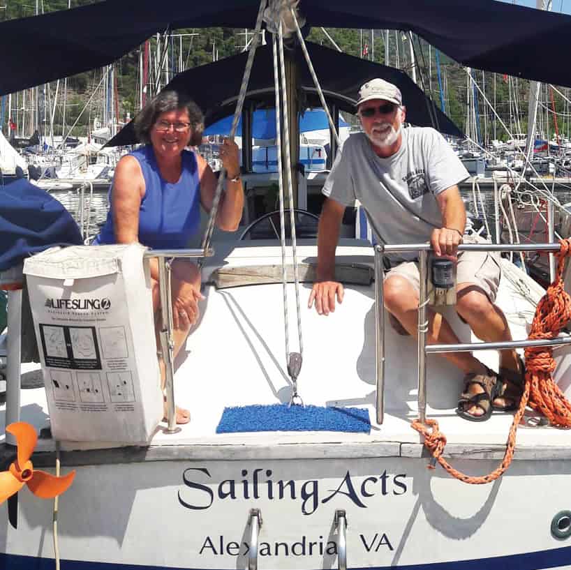 Linford and Janet Stutzman on their sailboat Sailing Acts.